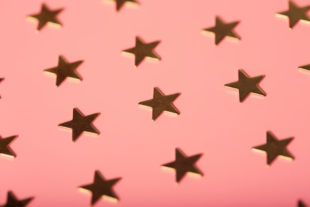 Pinky Hintergrund mit goldenen Sternen