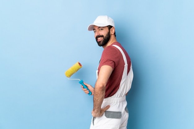 Foto pintor adulto hombre sobre fondo azul aislado