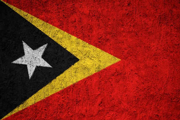 Pintou a bandeira nacional de Timor Leste em uma parede de concreto