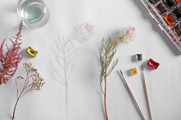 Pintura de acuarela con flores en hoja de álbum