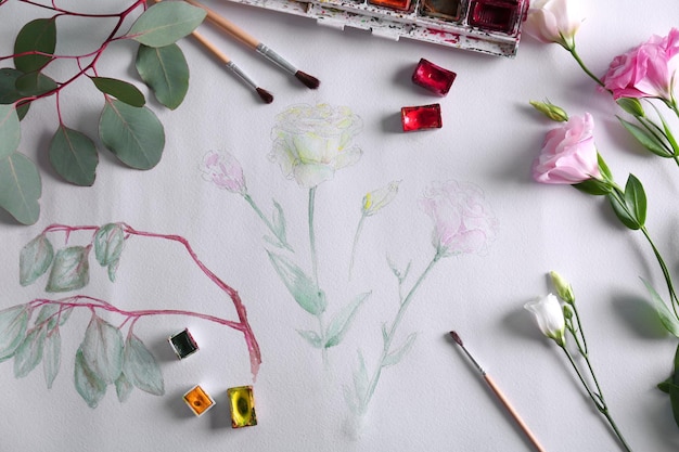 Pintura de acuarela con flores en hoja de álbum