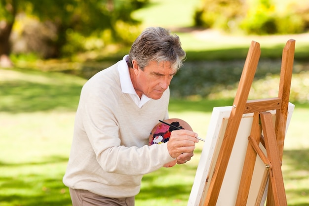 Pintura de anciano en el parque