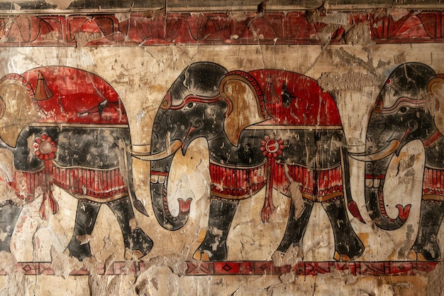 Foto una pintura de dos elefantes con un elefante rojo y negro en la pared