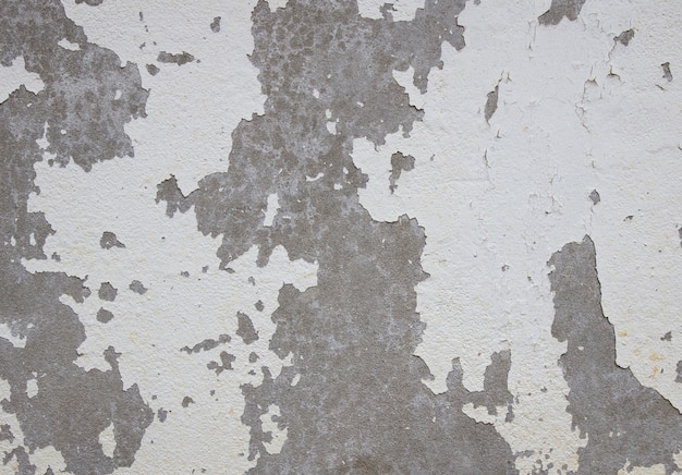 Foto pintura velha rachada na parede de concreto