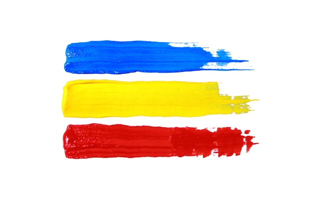 Pinturas acrílicas coloridas de colores primarios rojo, amarillo y azul