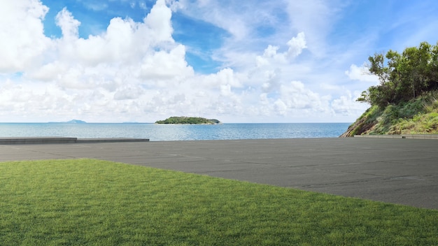 Piso de concreto da estrada e grande jardim com vista para o mar ilustração 3D de gramado verde vazio