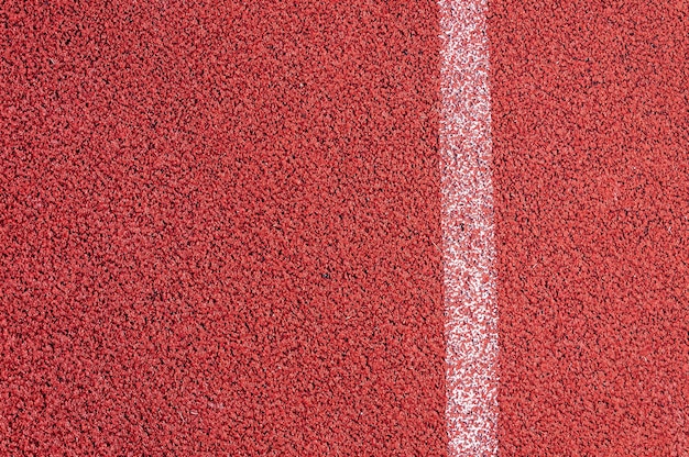 Pista de atletismo con textura de línea blanca textura deportiva para el fondo