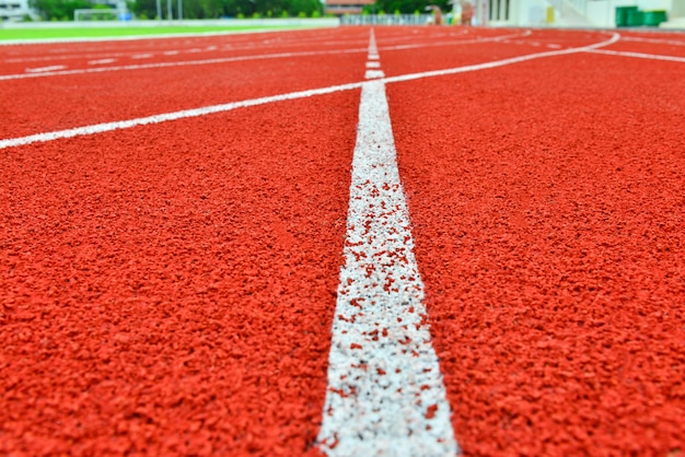 Foto pista roja en estadio para el fondo de atletas