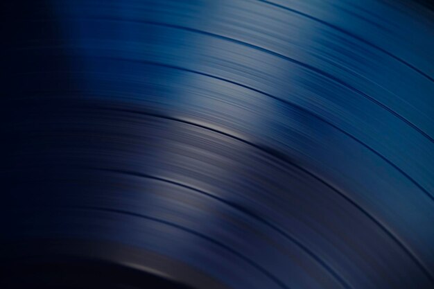 Pistas de sonido en una foto macro de primer plano de un disco de vinilo azul