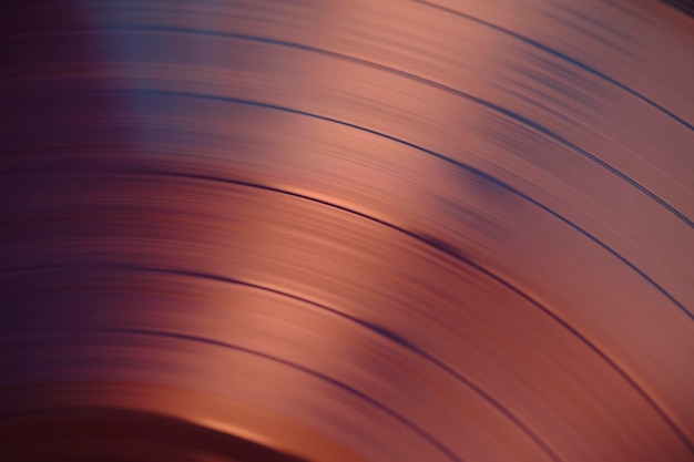 Foto pistas de sonido en una fotografía macro de primer plano de un disco de vinilo rosa