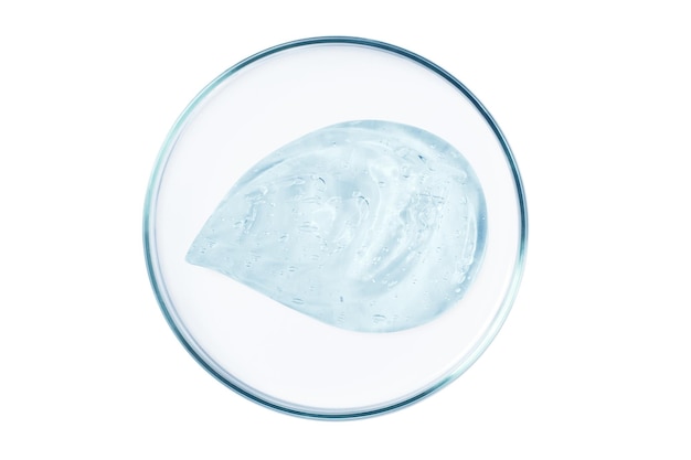 Placa de Petri com uma gota e um esfregão de um gel ou soro transparente em um fundo vazio