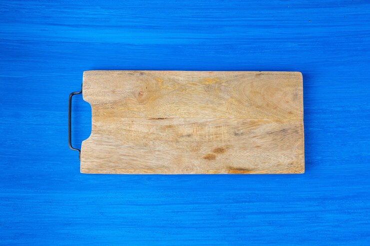 Foto placa para cortar alimentos e cozinhar em segundo plano.
