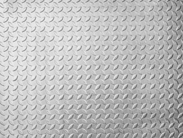 Placa de piso de metal con textura de patrón de diamante. panel de acero plateado con patrón diagonal, sin costuras de fondo metálico de chapa de acero.