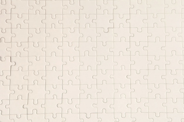 Planeje a superfície branca do quebra-cabeça para um background texturizado e papel de parede abstrato. copie o espaço para o texto