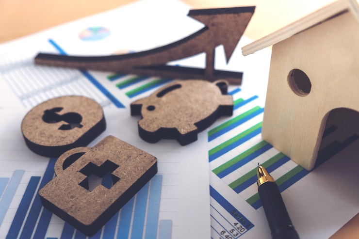Foto planilha de estoque bancário financeiro com casa