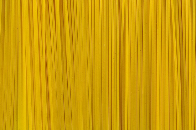 Plano de fundo amarelo longo espaguete Macro fotografiaTop Garment