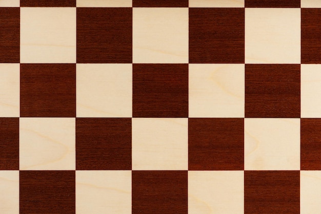 Foto plano de fundo da vista superior do tabuleiro de xadrez de madeira vazio