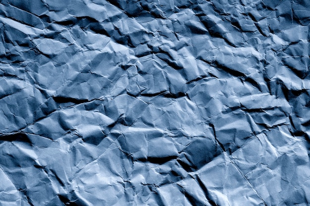 Foto plano de fundo e textura de papel azul amassado