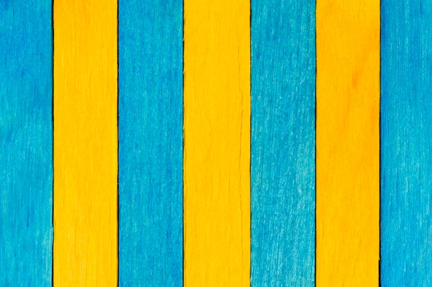 Plano de fundo texturizado de madeira bicolor em cores azuis e amarelas