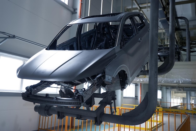 Planta de fabricación de automóviles, moviendo la carrocería del automóvil alrededor de la fábrica