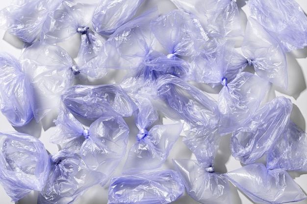 plastic bag free day background violet monochrome plastic bags top view pattern texture polyethylene packages zero waste eco friendly shopping sustainable life style plastic free eco trend