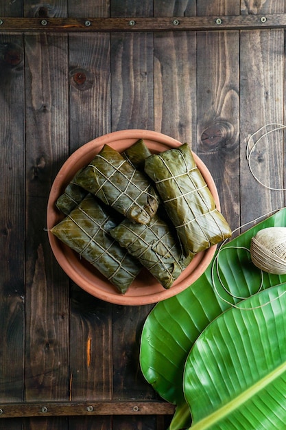 Plato navideño en Venezuela, hallacas, en hoja de plátano, masa de maíz rellena con guiso de cerdo