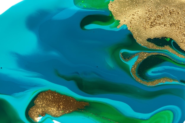 Pó de ouro abstrato de fundo azul e verde de imitação de ondas oceânicas