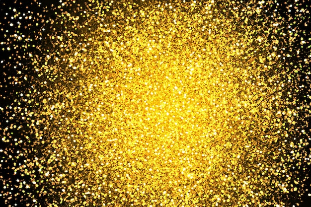 Foto pó de pó de glitter dourado estourando fundo