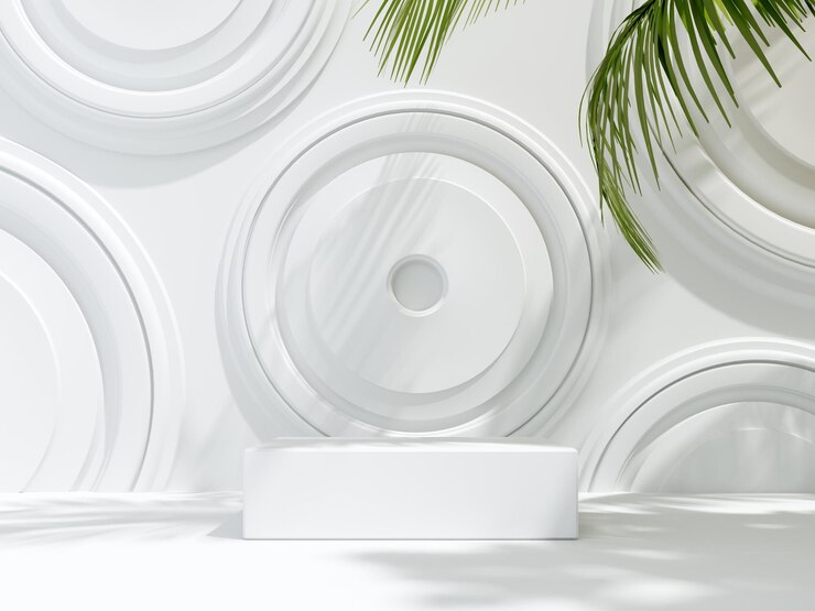 Podio de presentación 3D sobre fondo blanco claro con sombras y hojas tropicales verdes
