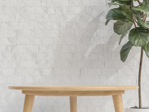 Foto podium de mesa de madera para producto con planta en pared de ladrillo blanco de fondo estilo minimalista