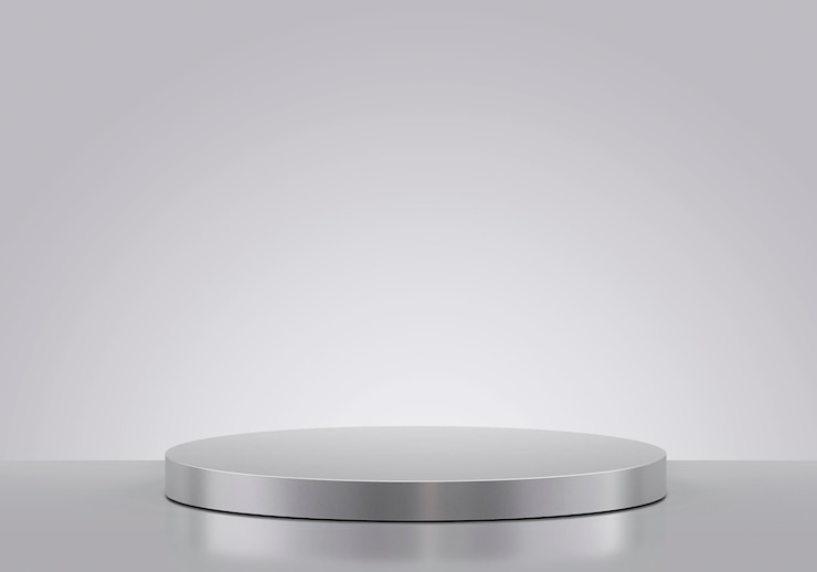 Foto podium metálico aislado sobre un fondo gris exposición de productos