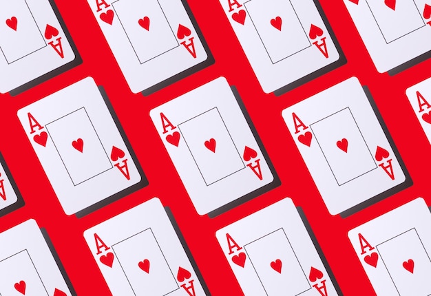 Foto poker-karten-herz-ass isoliert auf rotem hintergrund nahtloses muster