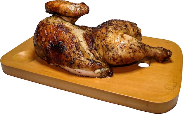 Pollo asado servido en una tabla de madera