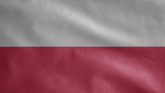 Polnische Flagge weht im Wind. Nahaufnahme von Polen Schablonenblasen, weiche und glatte Seide. Stoff Stoff Textur Fähnrich Hintergrund