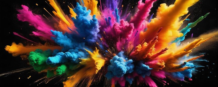 polvo de color que explota en el aire contra un fondo negro