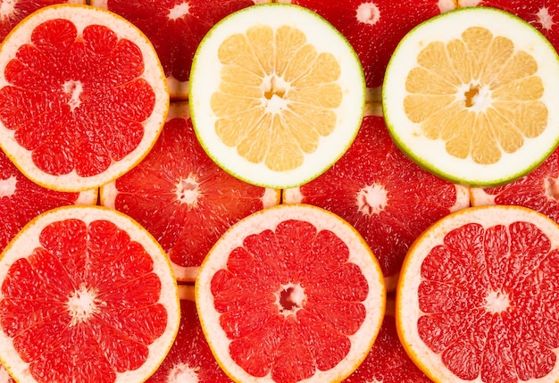 Pomelo und Grapefruit saftige Scheiben Hintergrund.