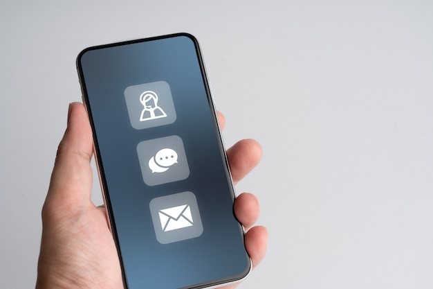 Foto póngase en contacto con nosotros icono de negocios en teléfonos inteligentes