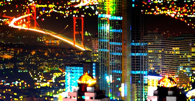 Foto ponte do bósforo iluminada e edifícios à noite