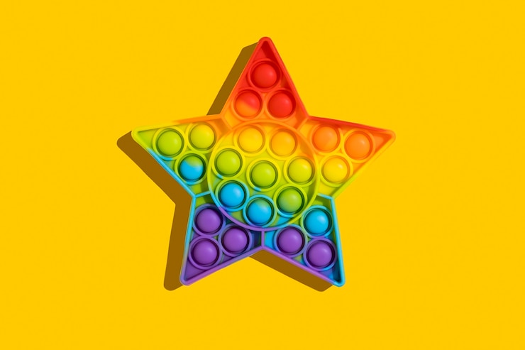Foto pop it un juguete de silicona de colores del arco iris de moda