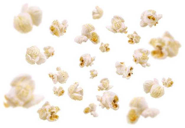 Foto popcorn fällt in die luft und das popcorn ist weiß