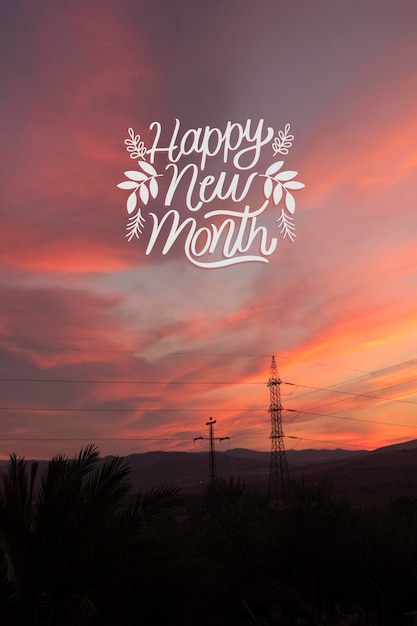 Foto pôr do sol com letras de feliz mês novo