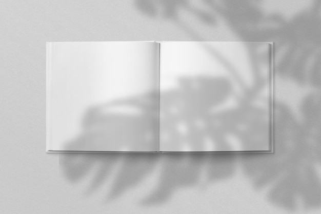 Foto portada de vista superior realista y retrato abierto revista a4 o a5 o folleto para papelería y marca plantilla de maqueta aislado fondo gris claro y superposición de sombra de hoja representación 3d