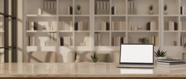 Portátil de pantalla en blanco sobre una mesa de mármol en la sala de estudio con estantería de libros en el fondo