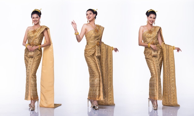 Porträt von Miss Asian Pageant Beauty Contest in Gold Thai Trachtenkleid mit heller Diamantkrone, Studiobeleuchtung weißer Hintergrund, Collagen-Gruppenpackung mit Körper in voller Länge isoliert