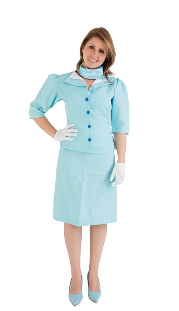 Portrait eines reizend Stewardesses kleidete in der blauen Uniform an