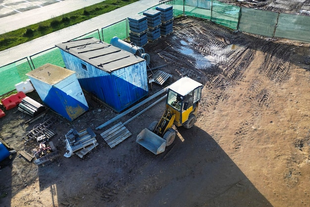 Potente cargador pesado o topadora vista desde arriba fotografía de drones Movimiento de tierras con equipo pesado en el sitio de construcción equipo de construcción de carreteras