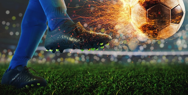 Foto potente patada de un futbolista con bola de fuego