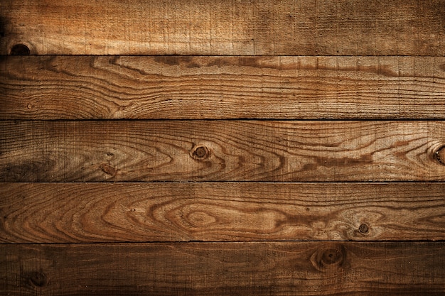 Foto prancha de madeira marrom velha. fundo de madeira escuro