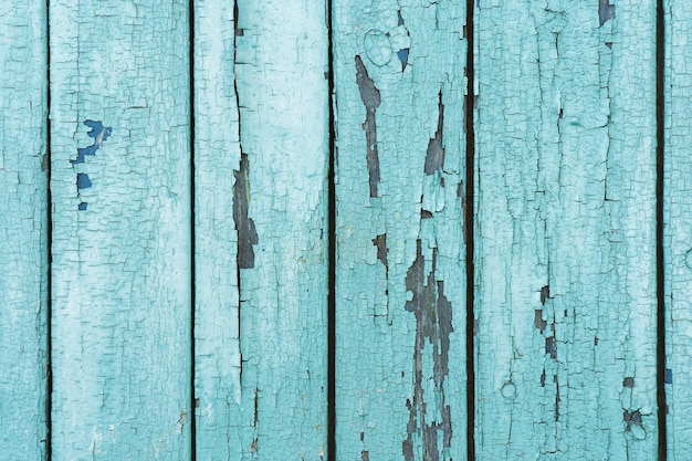 Pranchas de madeira velhas com tinta azul descascada rachada Fundo de textura pintada Fundo rústico