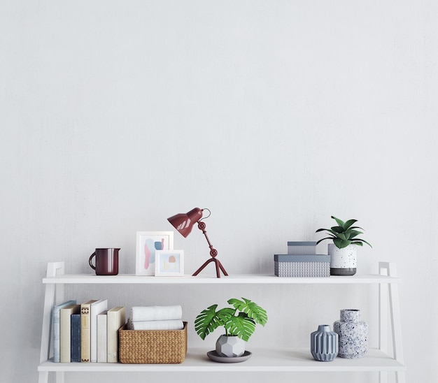 Prateleira branca com objetos de decoração e fundo de parede branca em branco